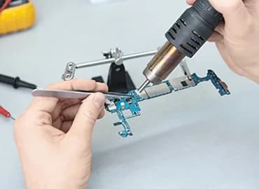 Phone repair work on a bench